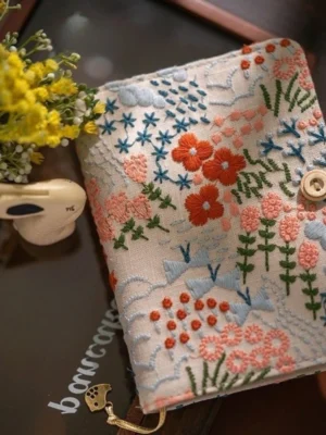 S8cb248b2cfdf4ebcae4f929582223c9d7.webp Embroidered Cotton Linen Thread-Bound Notebook